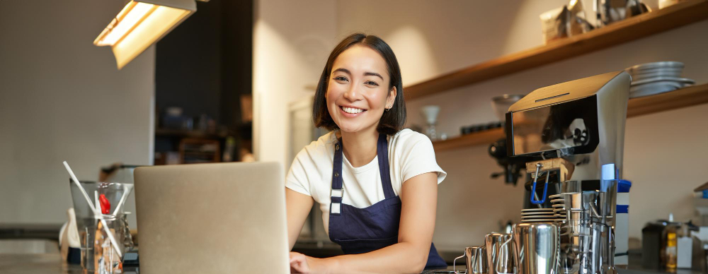 how to apply for SBA loan. small business borrower at computer success | SBA 504 Loan Application Checklist for Small Businesses | APC Lending